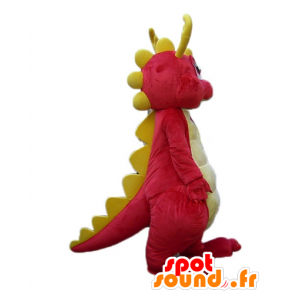 Rosa e giallo dinosauro mascotte, sorridente e colorato - MASFR22888 - Dinosauro mascotte