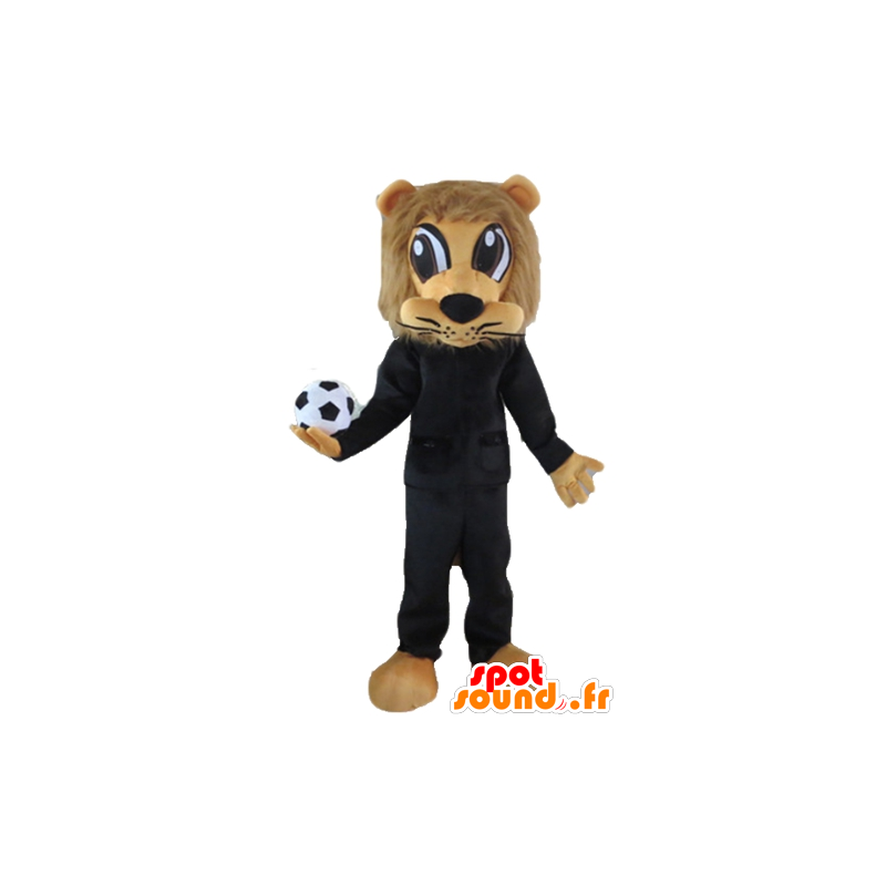 Brun lejonmaskot, i svart sportkläder, med en boll - Spotsound