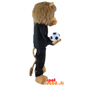 Leão mascote marrom, vestido de preto do esporte com uma bola - MASFR22966 - mascote esportes