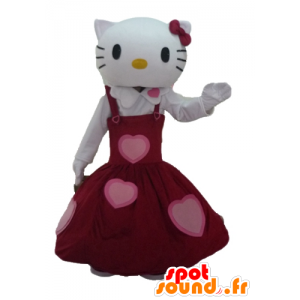 Mascote Olá Kitty vestida em um vestido vermelho bonito