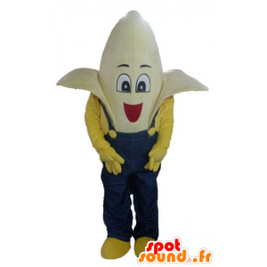 Mascotte de banane géante habillée d'une salopette bleue - MASFR23841 - Mascotte de fruits