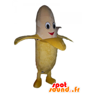 Banana gigante mascotte giallo e beige, sorridente - MASFR23846 - Mascotte di frutta