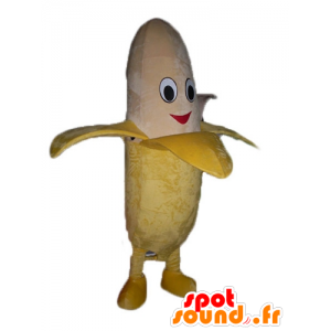 Mascotte de banane géante jaune et beige, souriante - MASFR23846 - Mascotte de fruits