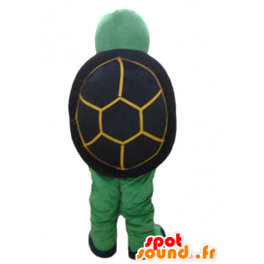 Mascotte gialla tartaruga verde e nero, cordiale e sorridente - MASFR24135 - Tartaruga mascotte