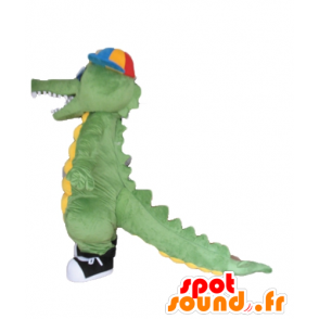 Groen en geel krokodil mascotte, met een pet - MASFR24143 - Mascot krokodillen