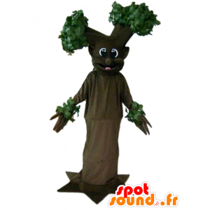 Brun og grøn træ maskot, kæmpe og smilende - Spotsound maskot