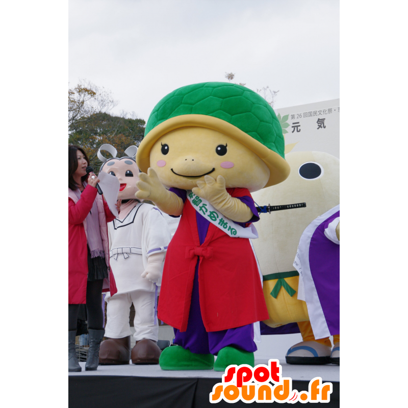 Mascot yellow and green turtle, red dress and purple - MASFR25123 - Yuru-Chara Japanese mascots