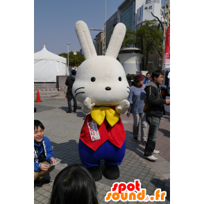 Mascotte de gros lapin blanc, en tenue jaune, bleue et rouge - MASFR25263 - Mascottes Yuru-Chara Japonaises