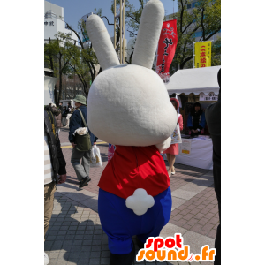 Mascotte de gros lapin blanc, en tenue jaune, bleue et rouge - MASFR25263 - Mascottes Yuru-Chara Japonaises