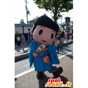 Japansk drengemaskot iført en blå tunika - Spotsound maskot