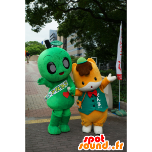 Two mascots, a green man, and an orange fox - MASFR25300 - Yuru-Chara Japanese mascots