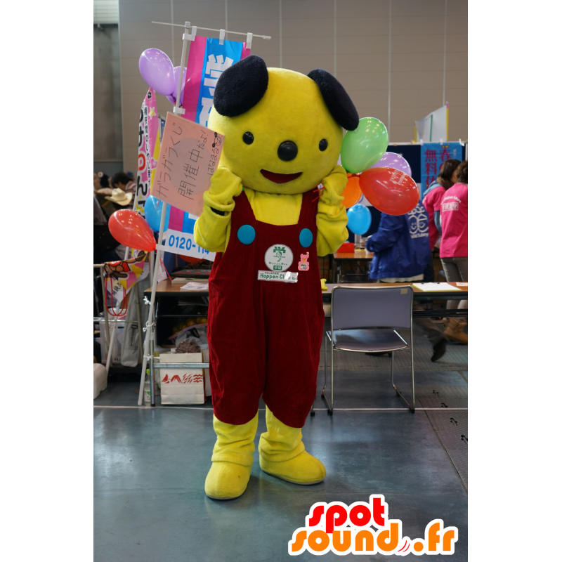 Mascot perro amarillo y negro con un mono rojo - MASFR25471 - Yuru-Chara mascotas japonesas