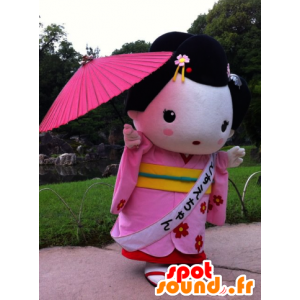 Asiatisk kvindemaskot, i lyserødt outfit og en parasol -
