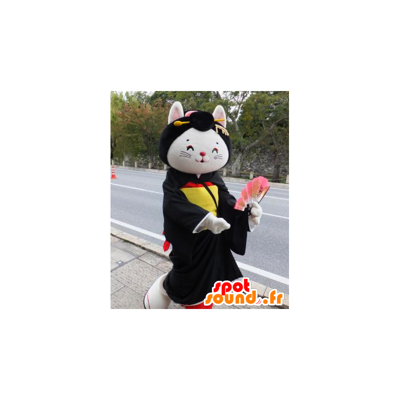 Hvit katt maskot, iført en svart tunika, gult og rødt - MASFR25946 - Yuru-Chara japanske Mascots