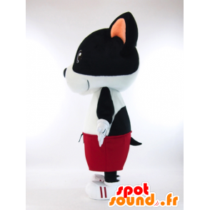 Kiyatsuchi maskot, svartvit hund med röda Bermuda shorts -