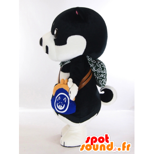 Shiba chan maskot, sort og hvid hvalp med en håndtaske -