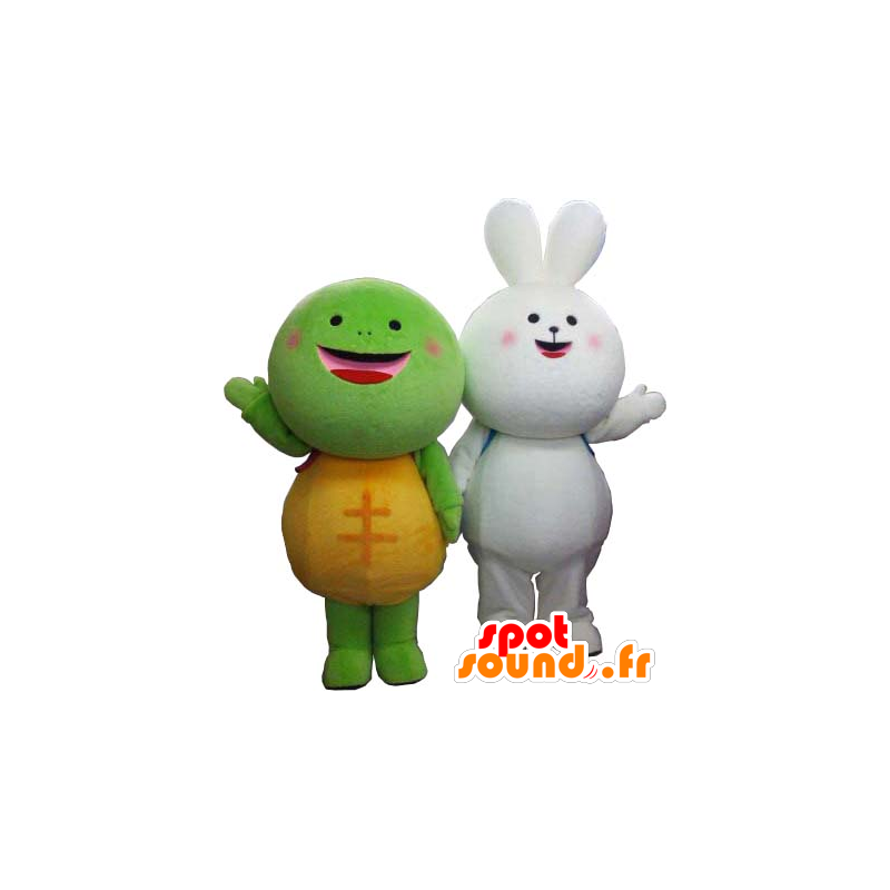 2 maskotar, en helt vit kanin och en grön och gul sköldpadda -