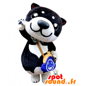 Shiba maskot, sort og hvid hund med en håndtaske - Spotsound