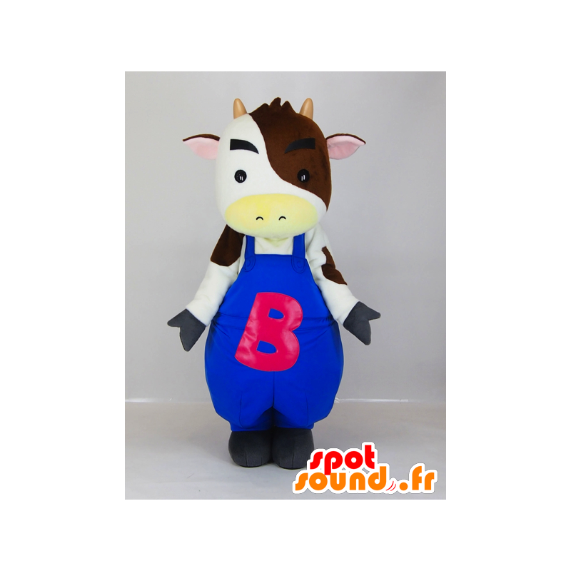 Maskot vit och brun ko i blå overall - Spotsound maskot