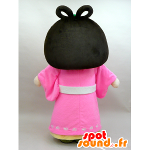Nuna maskot. Mascot brunette kvinde i lyserød kjole - Spotsound