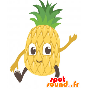 Maskottgul och grön ananas, jätte. Fruktmaskot - Spotsound