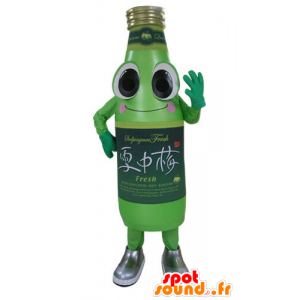 Grön läskflaskmaskot, leende och rolig