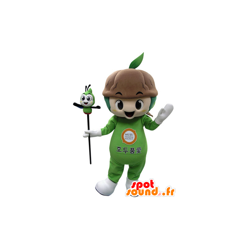 Grön växtmaskot med jord - Spotsound maskot