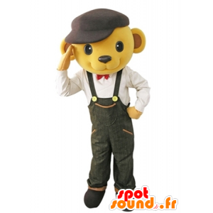 Bären-Maskottchen-gelben Overalls mit einem Barett gekleidet - MASFR031619 - Bär Maskottchen