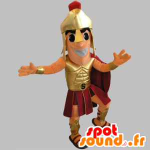 Gladiador Mascote segurando dourado e vermelho - MASFR031785 - Mascotes humanos