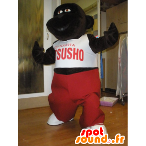 Dark brown gorilla mascot with a red and white outfit - MASFR031966 - Gorilla mascots