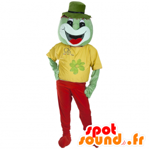 Grön varelse maskot, leende, klädd i rött och gult - Spotsound