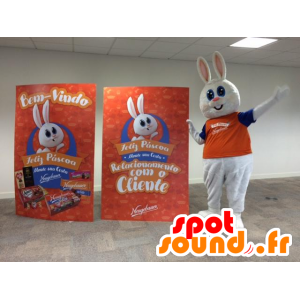 Bílý zajíček maskot, roztomilých a baculaté, oblečený v oranžové - MASFR032191 - maskot králíci