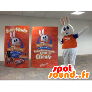 Hvid kanin maskot, fyldig og sød, klædt i orange - Spotsound