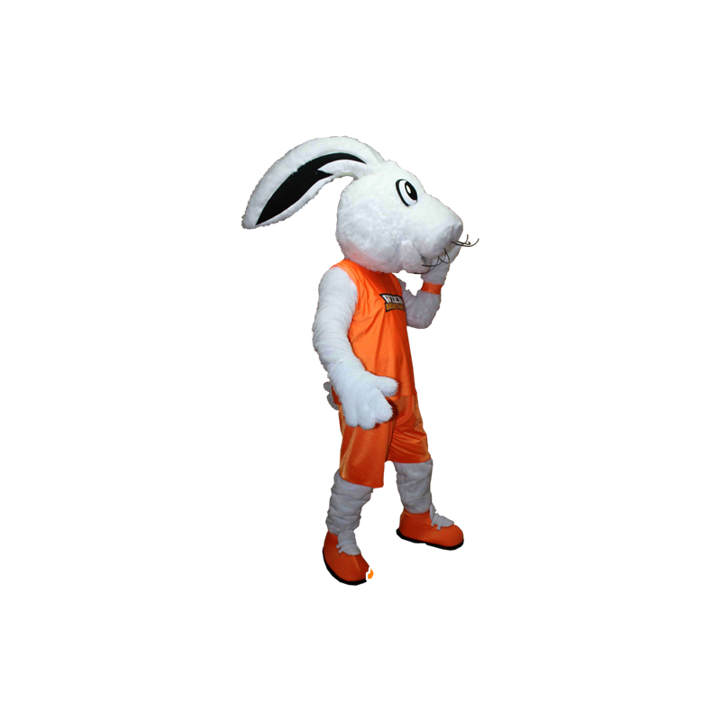 Vit kaninmaskot klädd i en orange sportdräkt - Spotsound maskot