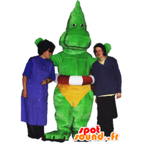 Dragon mascot, green dinosaur with a yellow slip - MASFR032486 - Dragon mascot