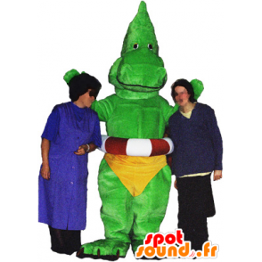 Dragão mascote, dinossauro verde com um deslizamento amarelo - MASFR032486 - Dragão mascote