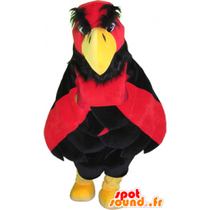 Röd och gul örnmaskot med svarta shorts - Spotsound maskot