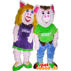 2 mascotes homem porco e mulher em trajes coloridos - MASFR032682 - Mascotes femininos