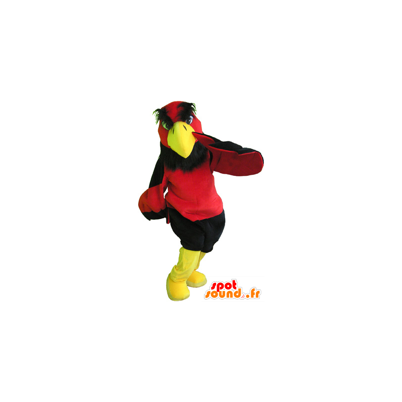 Röd och gul gammaskot med svarta shorts - Spotsound maskot