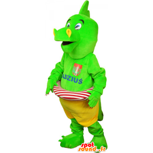 Prangende grøn dinosaur maskot i shorts med en bøje - Spotsound