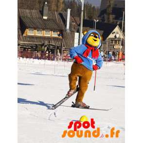 Brun og gul bjørnemaskot i ski-outfit. Vinterbamse - Spotsound
