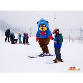 Brun og gul bjørnemaskot i ski-outfit. Vinterbamse - Spotsound