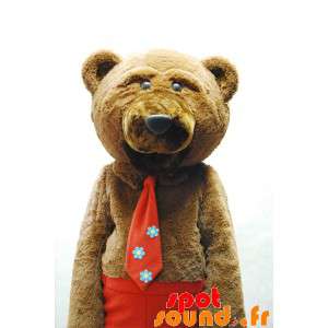 Brun bjørnemaskot med slips og røde bukser - Spotsound maskot