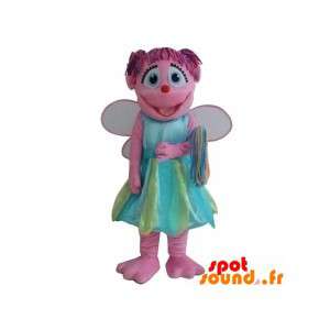 Pink fe maskot, smilende med en farverig kjole - Spotsound