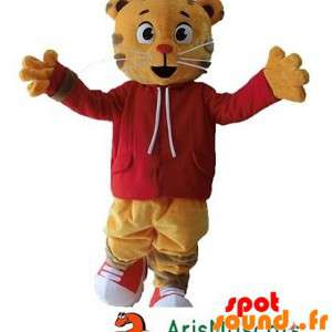 虎のマスコット、赤いセーターとオレンジ色の猫