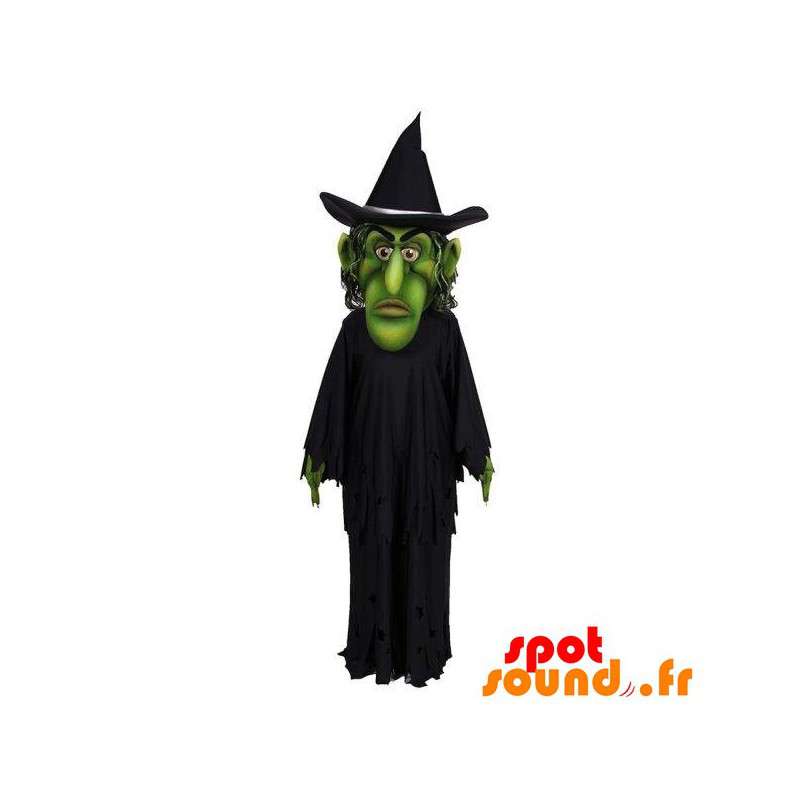 Grøn heksemaskot klædt i sort - Spotsound maskot