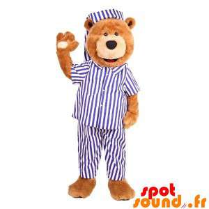 Nallebjörnmaskot klädd i en blå och vit pyjamas - Spotsound