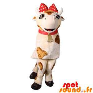 Hvid og brun ko med en rød sløjfe - Spotsound maskot
