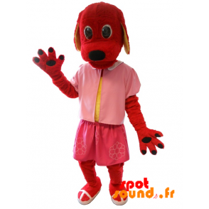 Mascotte de chien rouge habillé en rose. Costume de chien