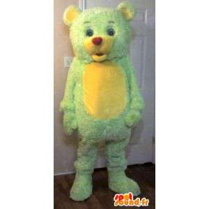 Liten nallebjörn maskot, gul och grön björn förklädnad -